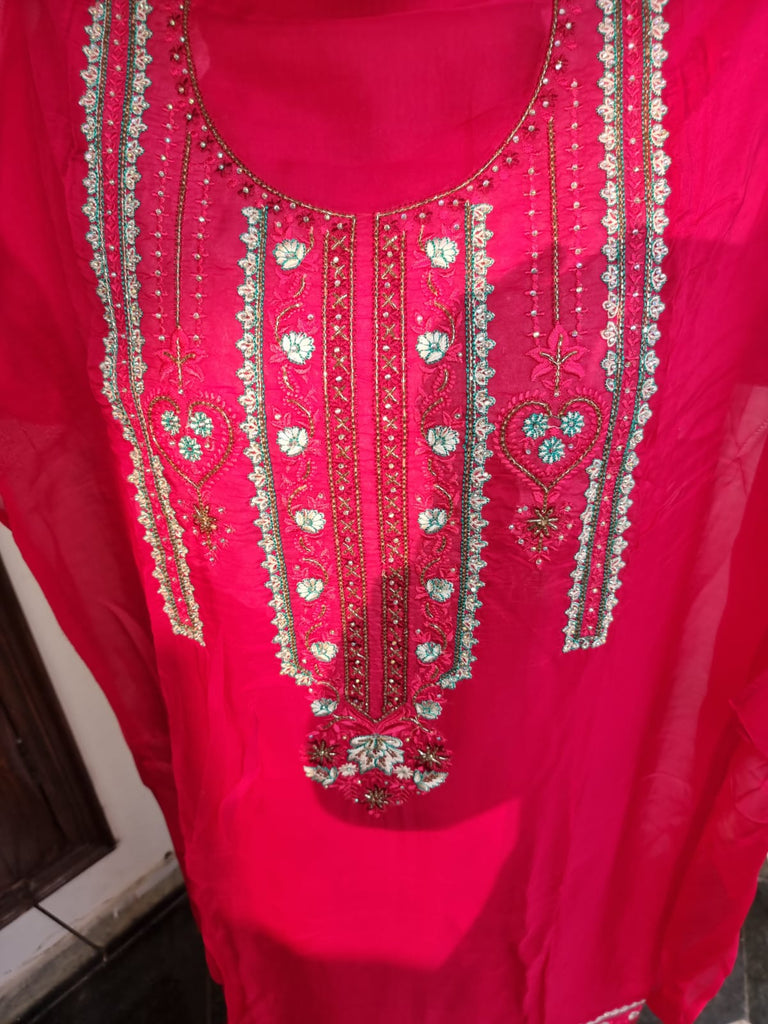 Red color suit with heavy neck work