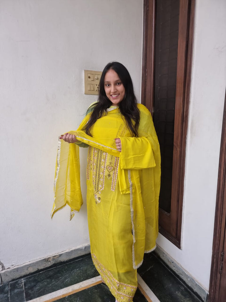 Yellow color suit with heavy neck work